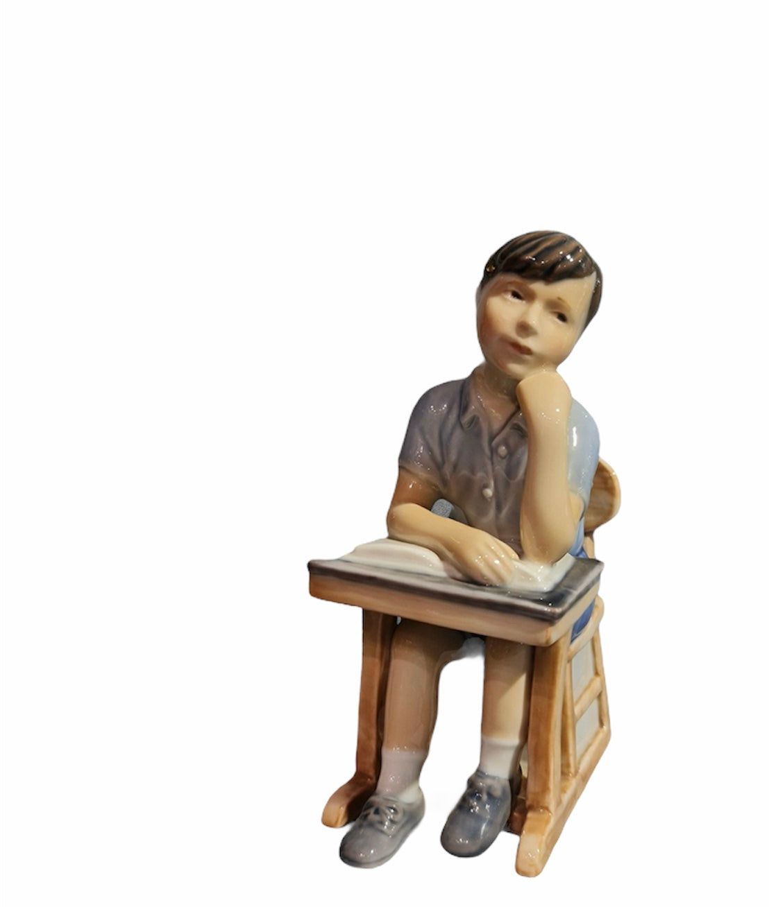 Royal Copenhagen Child on a school desk